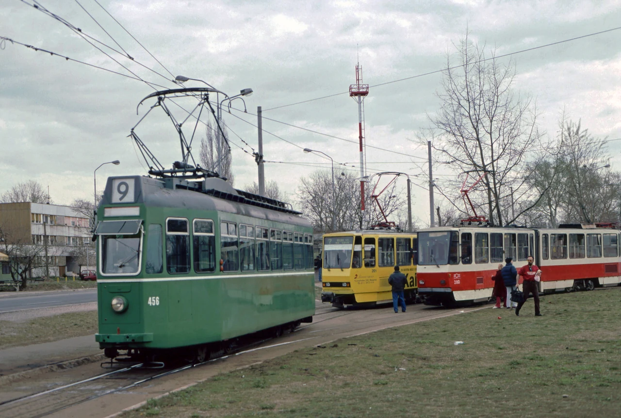 A tram carrying a route 9 board, with a trailer.