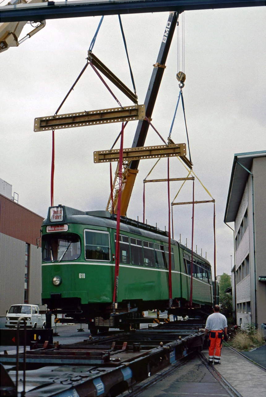 Trams prepared for transport by rail.